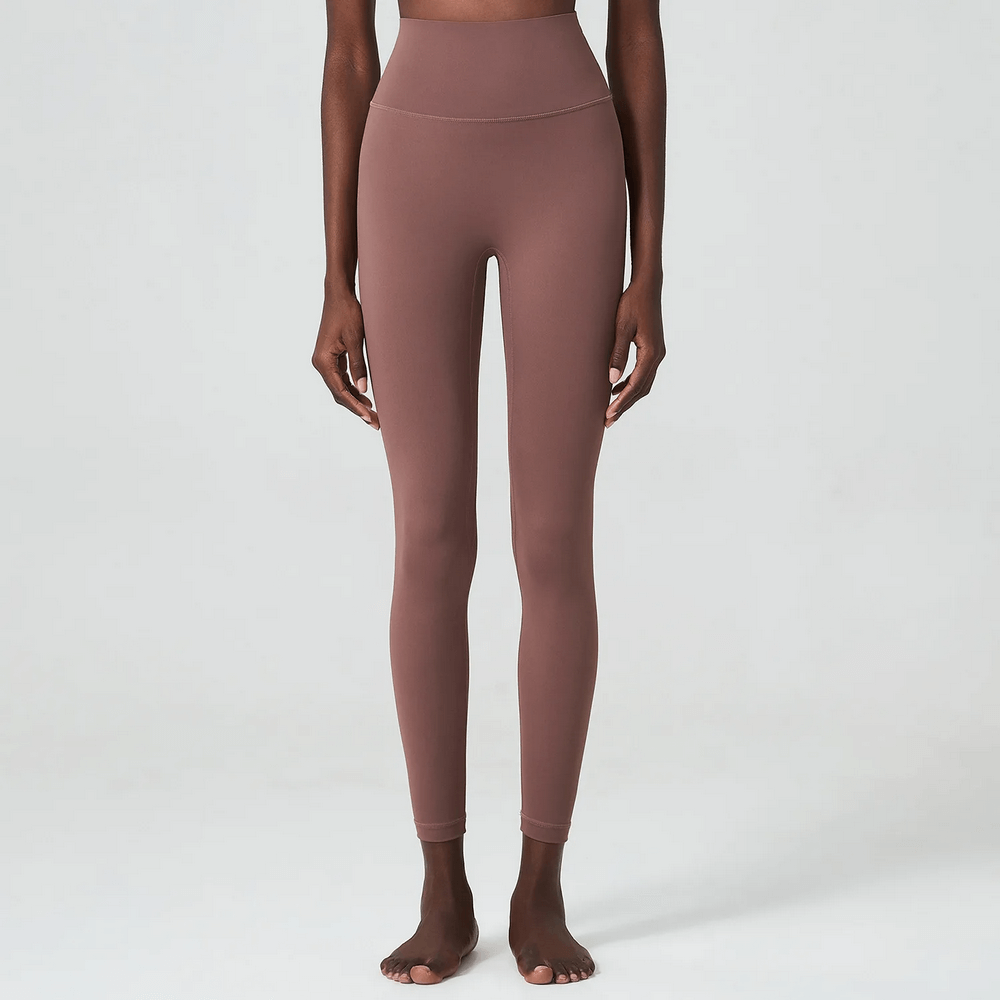 Model wearing stylish women's ankle-length yoga leggings SF2097, showing durable elastic waist and full-length fit for versatile activity.